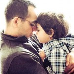 Father Holding Son Close